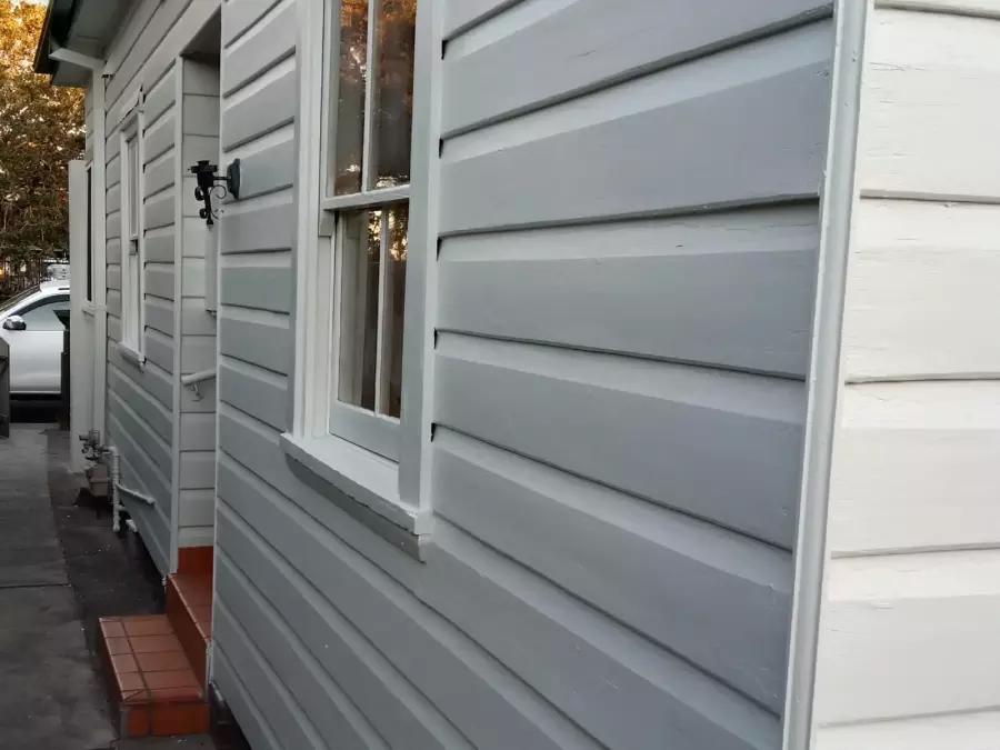 Restored timber weatherboards after preparation and painting